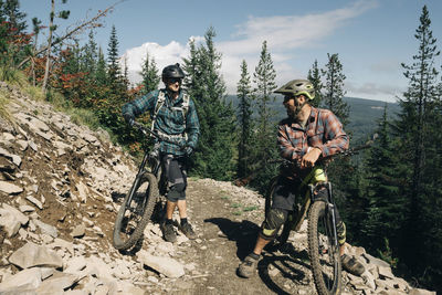 Two bikers take a break on the trail at the timberline bike park in or