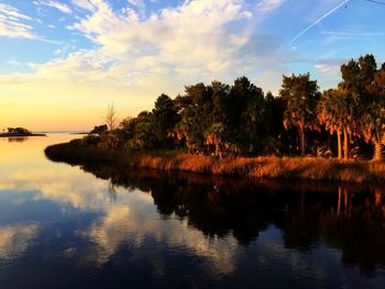 Scenic view of lake at sunset
