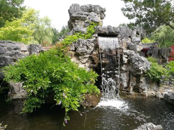 View of waterfall along rocks