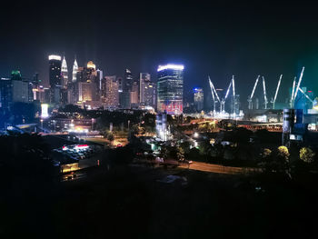 Illuminated buildings in city at night
