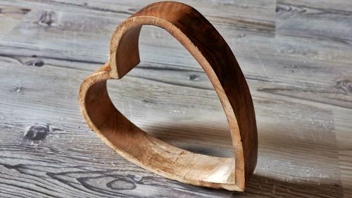 High angle view of wooden heart shape on table