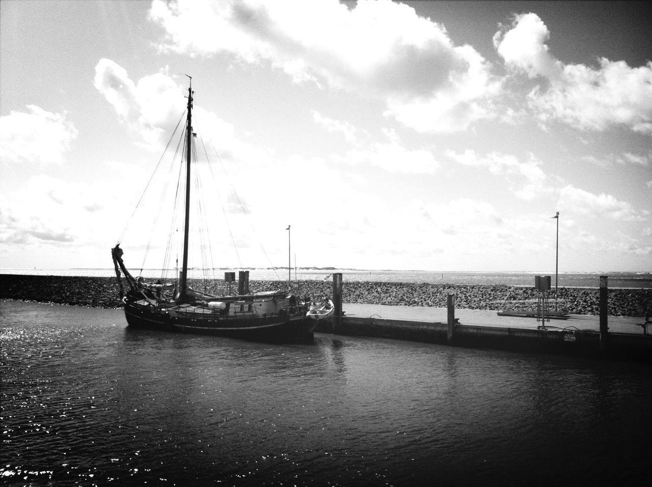 water, sea, nautical vessel, sky, transportation, boat, mode of transport, horizon over water, sailboat, tranquil scene, tranquility, mast, rippled, waterfront, cloud - sky, nature, scenics, pier, beauty in nature, cloud