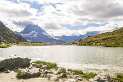 View of matterhorn mountain from roterboden with lake in foreground