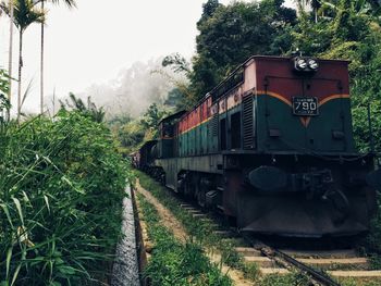 Train on railroad track against sky