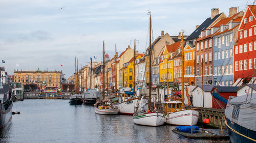 Boats moored at harbor