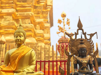 Statue of temple outside building