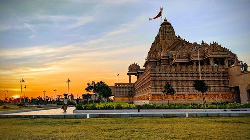 Traditional building against sky during sunset