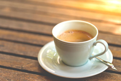 Close-up of coffee cup on table