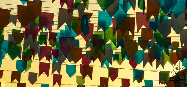 Full frame shot of multi colored flags hanging