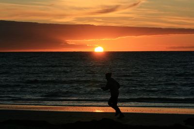 Scenic view of sea at sunset