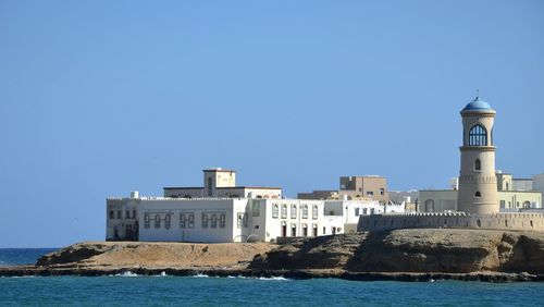 View of built structures against clear sky