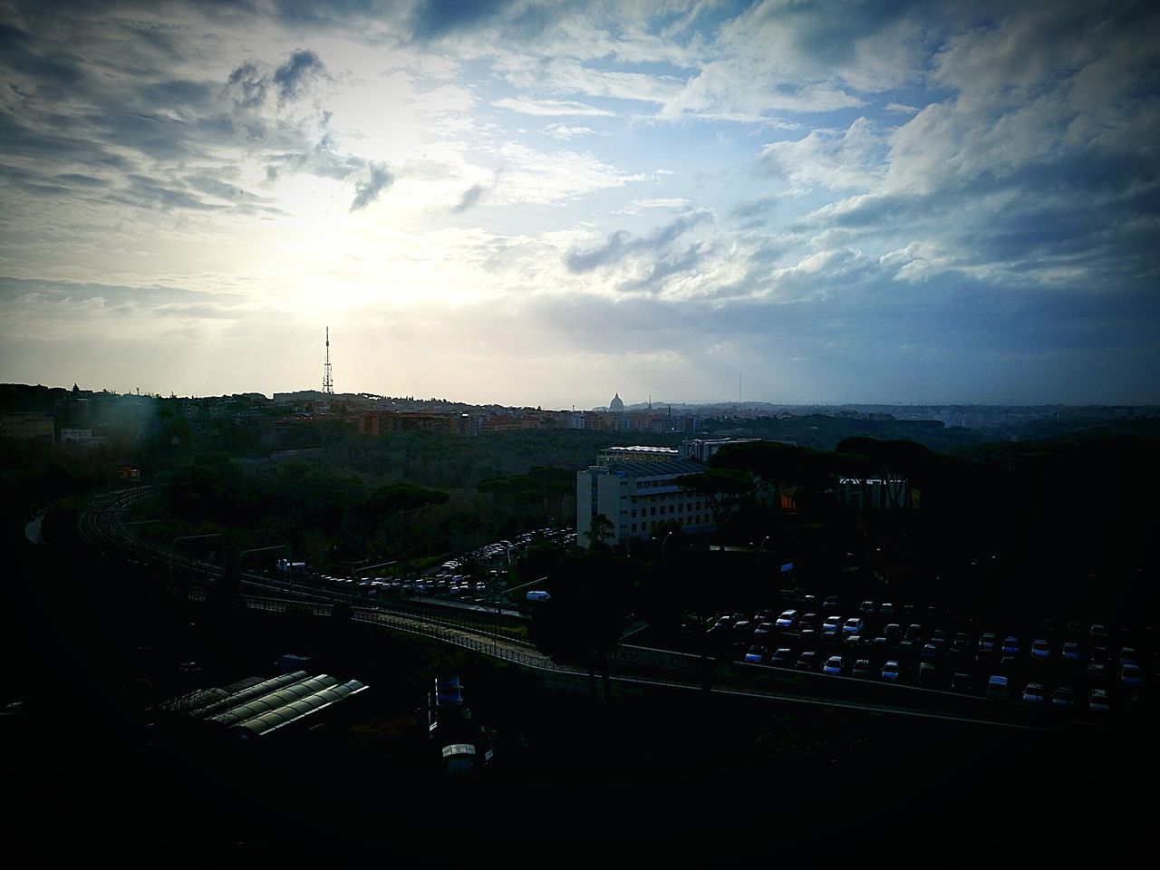 HIGH ANGLE VIEW OF CITY AT DUSK