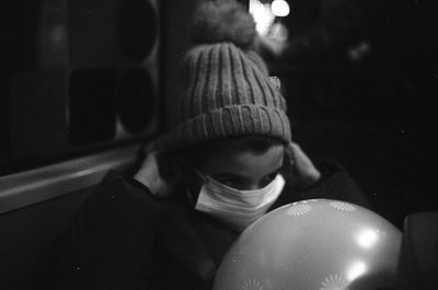 Close-up portrait of boy wearing hat