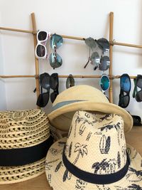 Close-up of clothes hanging on table against wall at home