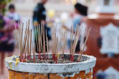 Incense sticks burning outside temple