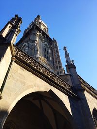 Low angle view of built structure against clear blue sky