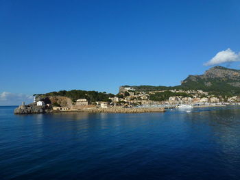 Scenic view of sea and buildings against sky porto soller, majorca