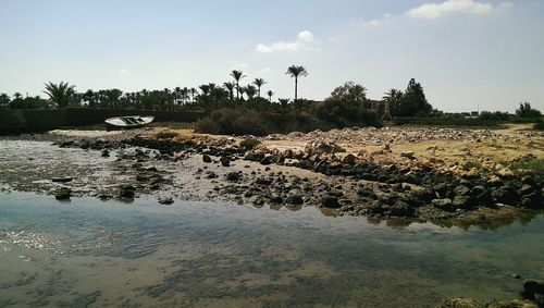 View of calm beach against the sky