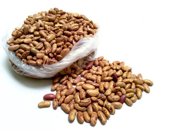 Close-up of coffee beans against white background