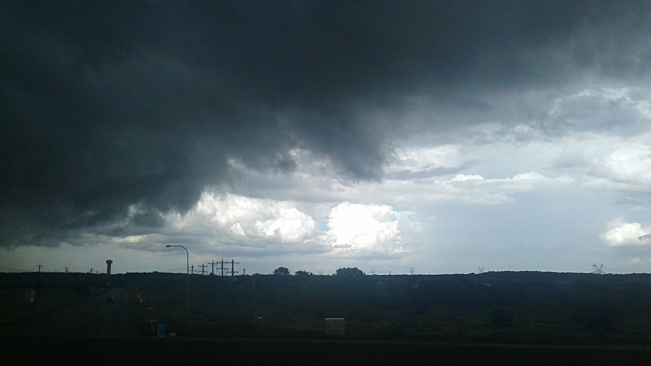 SCENIC VIEW OF STORM CLOUDS OVER LANDSCAPE