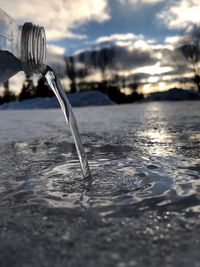 Close-up of rippled water in sea against sky