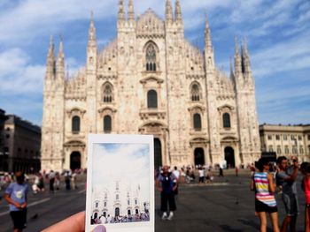 Tourists in front of building