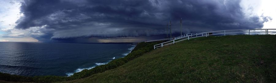 Scenic view of sea against cloudy sky