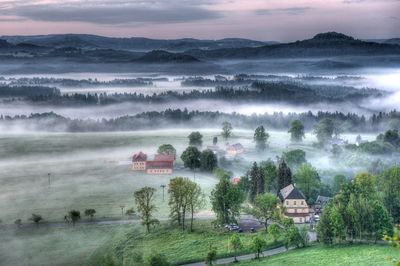 Scenic view of landscape against cloudy sky