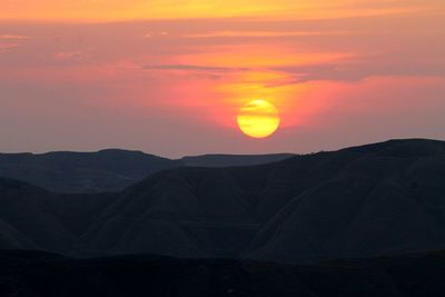 Scenic view of mountains at sunset