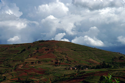 Scenic view of landscape against cloudy sky