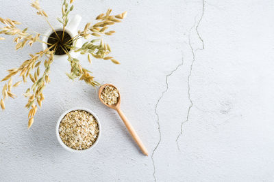 Directly above shot of wedding rings on white background