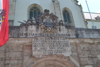 Low angle view of text on building