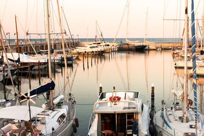 Boats moored at harbor