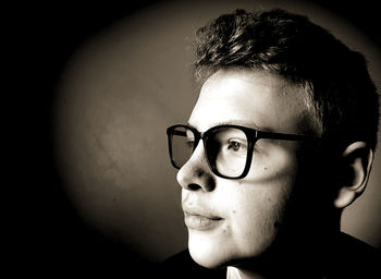 Close-up portrait of young man wearing eyeglasses