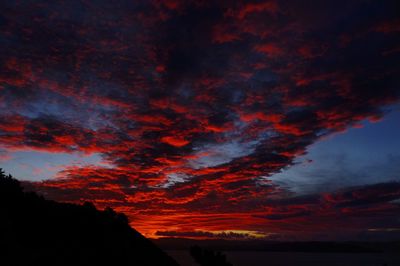 Low angle view of dramatic sky at sunset