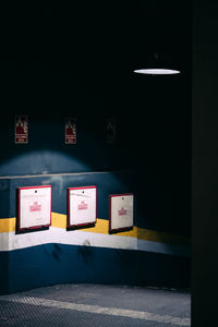 Information sign on wall of illuminated building