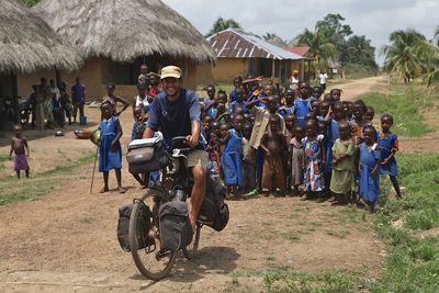 People on motorcycle against sky