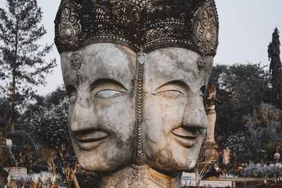 Close-up of statue against trees