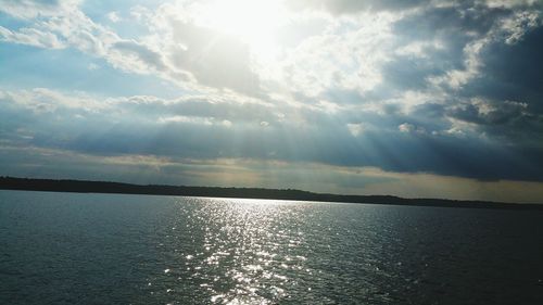 Scenic view of sea against cloudy sky