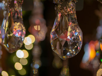 Close-up of christmas decoration hanging on glass