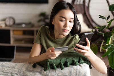 Young woman using mobile phone