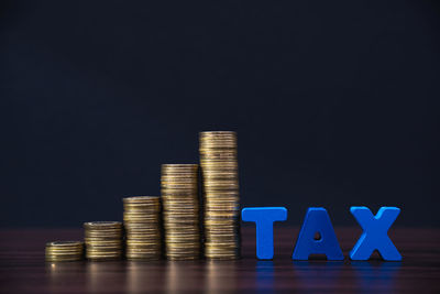 Stack of blue light on table against black background