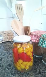 Close-up of fruits in jar on table