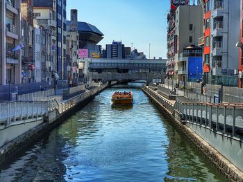 Canal amidst buildings in city