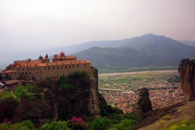 Castle on mountain against sky