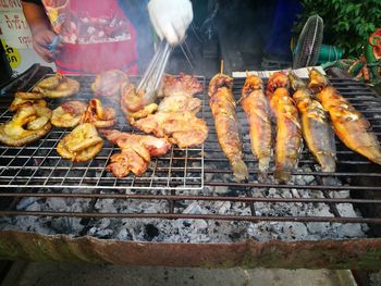 High angle view of meat on barbecue grill