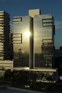 Modern buildings in city against sky