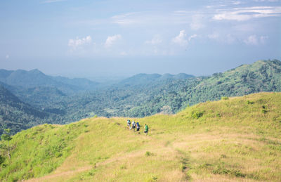 Scenic view of landscape and mountains against sky