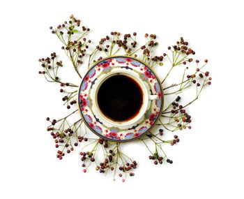 Directly above shot of coffee cup against white background