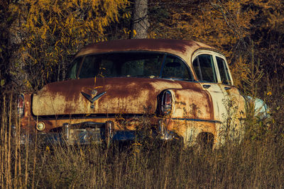 Old abandoned house on field